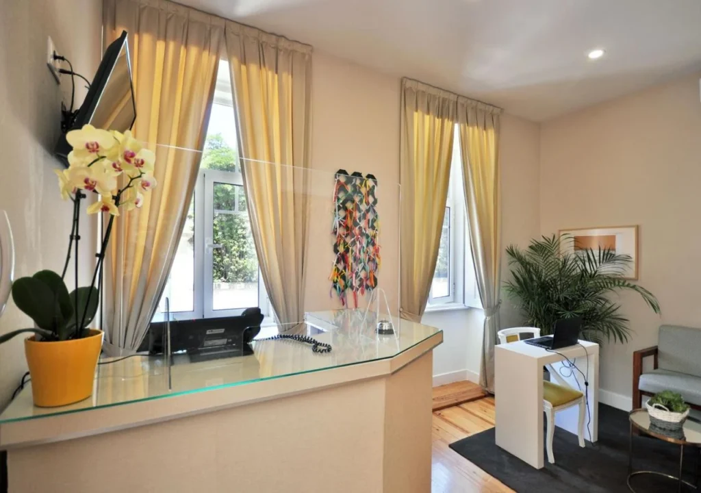 Bright reception area with orchids, large windows, and modern decor.